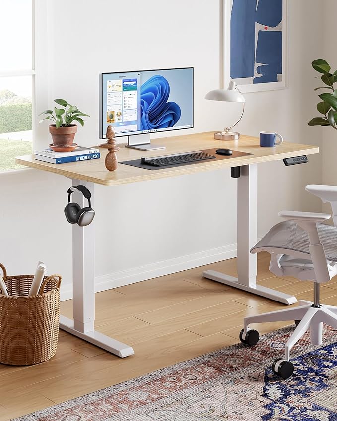 HUANUO 55" x 28" Electric Standing Desk Adjustable Height, 4 Memory Height Settings, Headphone Hook, Cable Manager, Sit Stand Up Desk for Home Office & Computer Workstation, Nature