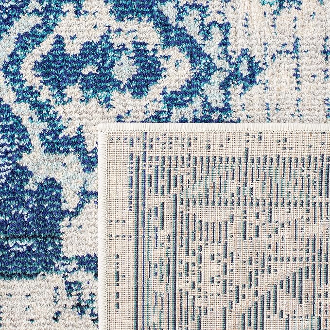SAFAVIEH Monaco Collection Area Rug - 6'7" x 9'2", Ivory & Blue, Boho Chic Medallion Distressed Design, Non-Shedding & Easy Care, Ideal for High Traffic Areas in Living Room, Bedroom (MNC243A)